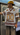 Person wearing a sports jersey on a subway train with visible branding.